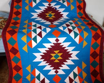 This is a 57" X 81" Southwestern Style Quilt in Wall Hanging or Lap Top Quilt