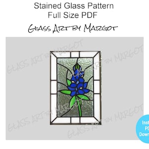 May include: A stained glass pattern featuring a bluebonnet flower in a rectangular frame. The pattern is available as a full-size PDF download. "Glass Art by Margot" is written in the image.