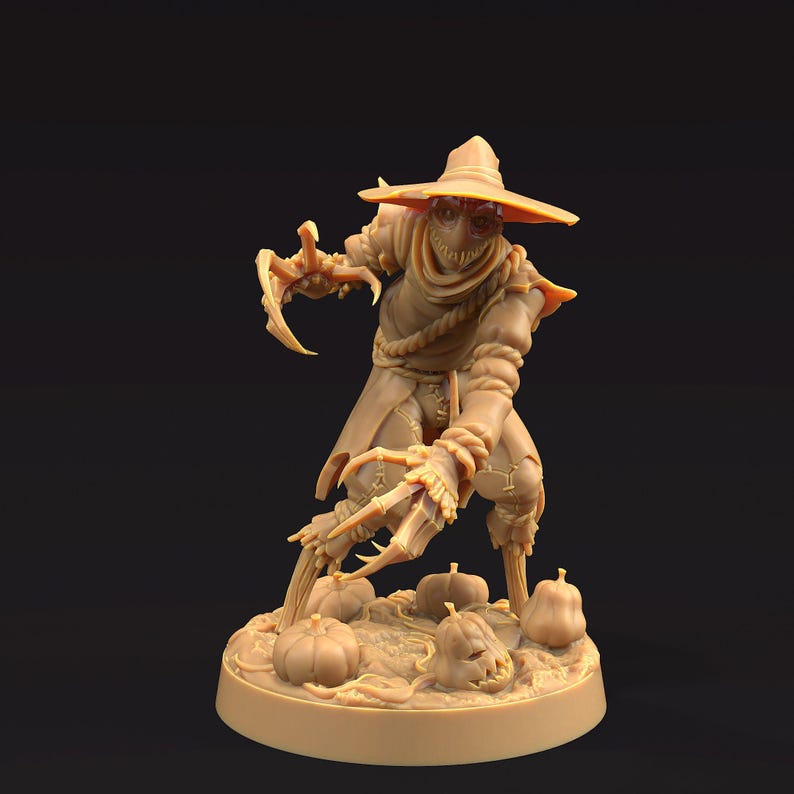 May include: A tan-colored figurine of a scarecrow with a wide-brimmed hat and claw-like hands. The scarecrow is standing on a base with several pumpkins, including one with a carved face. The figure has a stitched mouth and a rope around its neck.