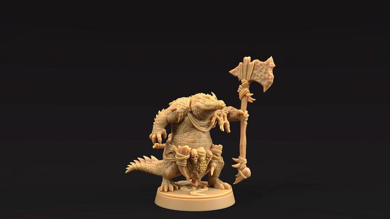 May include: A miniature figurine of a crocodile-like creature holding a wooden axe. The creature is painted in a light brown color and has a detailed sculpt.
