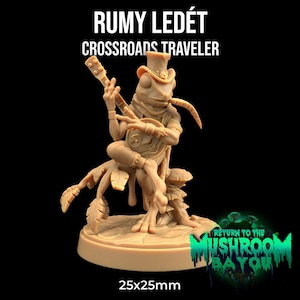 Pode incluir: Uma figura miniatura pintada de uma criatura semelhante a um sapo tocando um alaúde. A figura está usando um chapéu e está sentada em uma base com um design de folhas. A base mede 25 mm x 25 mm. A figura faz parte do jogo Return to the Mushroom Bayou.