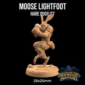 May include: A miniature figurine of a hare wearing boxing gloves and a loincloth. The figurine is painted in a light brown colour and is standing on a round base. The base is labelled "25x25mm" and "Critterfolk of Bluewoods Barrow".