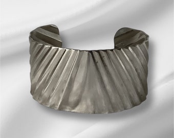 Silver Cuff Bracelet Metal with a diagonal design 6 inches long 1.25 inches wide