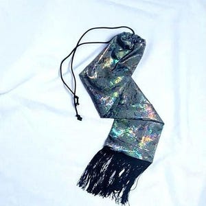Holographic snake skin horse tail bag with fringe.