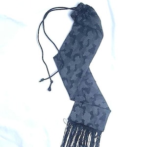 Black and gray camo  horse tail bag with fringe.