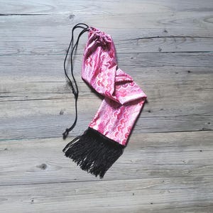 Flashy pink pattern with a bit of splash horse tail bag.