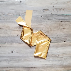 Fun, colorful, flashy gold horse tail bag.