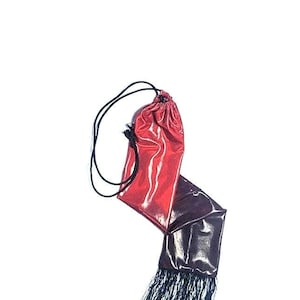 Red ombre horse tail bag with fringe.