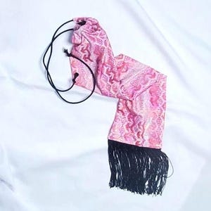 Flashy pink pattern with a bit of splash horse tail bag.
