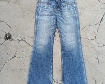 Distressed Levi's 707 flare jeans denim. Size 30