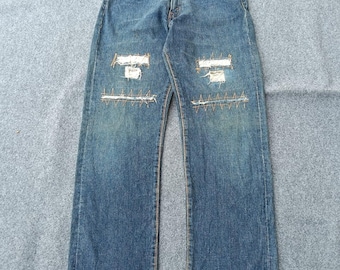 Vintage 90s Levi's 502 Big E Selvedge Denim Made in Japan.
