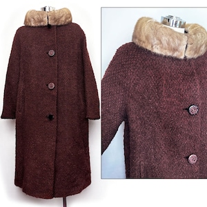 May include: A long, brown wool coat with a fur collar. The coat has a button closure and is lined with a brown fabric.