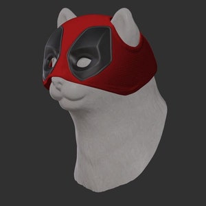 Puede incluir: Un busto de gato de cerámica blanca con una máscara de Deadpool roja y negra.
