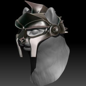 Puede incluir: Un casco de gato plateado y negro con una cresta puntiaguda y una máscara facial detallada. El casco tiene una superficie texturizada y un diseño elegante.