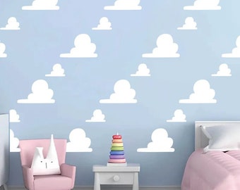 May include: A light blue wall featuring a repeating pattern of white, stylised cloud decals. The clouds are arranged in a scattered, non-uniform layout across the entire surface, creating a simple, graphic sky-themed design for a wall.