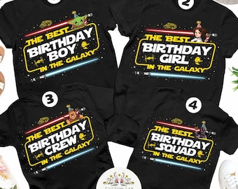 May include: Four black t-shirts with a Star Wars theme. The shirts have yellow text that reads "The Best Birthday" followed by "Boy", "Girl", "Crew", and "Squad". Each shirt features a different Star Wars character.