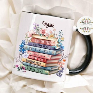 May include: White ceramic mug with a black handle. The mug features a stack of colorful books with flowers and the text "NAME" and "CUSTOM TEXT" repeated on each book.