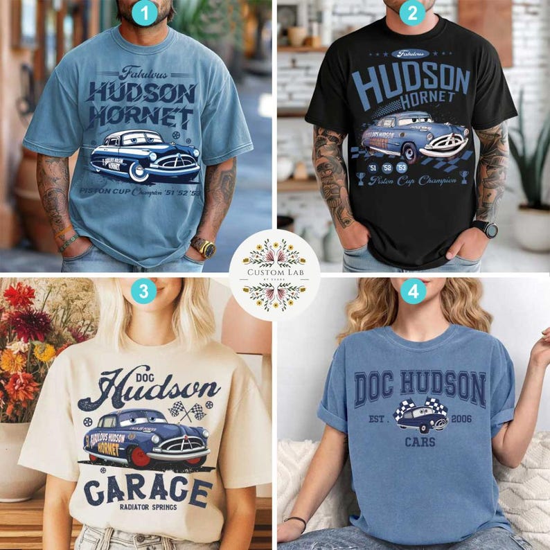 May include: Four t-shirts with car-themed designs. The shirts are light blue, black, cream, and blue. Each shirt features a graphic of a vintage car and text, including "Hudson Hornet," "Doc Hudson," and "Garage."