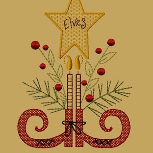 May include: Embroidered design of two red elf boots with a yellow star on top that says "Elves". The boots have black laces and are surrounded by green pine branches and red berries.