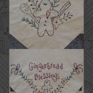 May include: Two white fabric squares with embroidery designs. The top square features a gingerbread person with a heart and surrounded by leaves and a star. The bottom square features a gingerbread person with the text "Gingerbread Blessings" above.