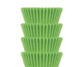 May include: A stack of four green cupcake cases. The cases are made of paper and have a fluted design.
