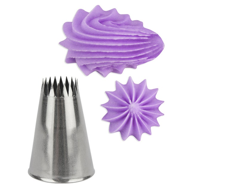May include: A stainless steel piping tip with a star-shaped opening. Two purple frosting swirls made with the tip are shown.