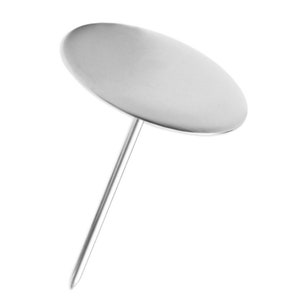 May include: A silver cake decorating tool with a round, flat top and a long, thin pin.