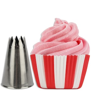 May include: A stainless steel star-shaped piping tip with a red and white striped cupcake liner. The cupcake is filled with pink frosting.