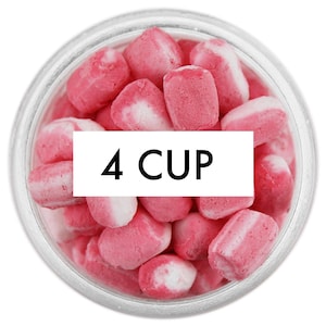 May include: A clear glass jar filled with pink and white candies. The candies are small, oblong, and have a two-tone appearance. The text "4 CUP" is displayed on a white rectangle in the center of the jar.