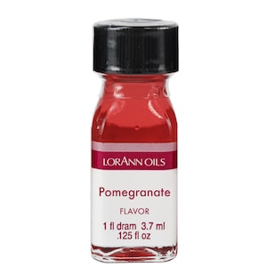 May include: A small glass bottle with a black cap filled with red liquid. The bottle is labeled "LorAnn Oils Pomegranate Flavor 1 fl dram 3.7 ml .125 fl oz"