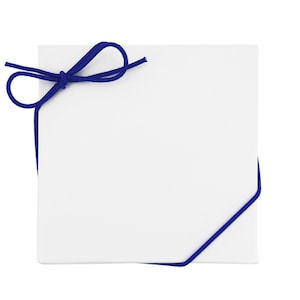 May include: A white square gift box with a navy blue cord tied in a bow. The cord wraps around the box, creating a simple, elegant presentation. The box is plain, offering a clean aesthetic suitable for various gifts.