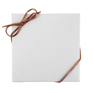 May include: A white gift box with a brown satin ribbon tied in a bow.