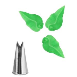 May include: A silver metal piping tip with a V-shaped opening. Three green leaf-shaped icing decorations are shown in the background.