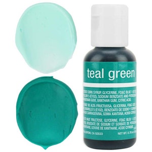 May include: Teal green food coloring in a small bottle with a white cap. Two small swatches of the color are shown on a white background. The bottle label reads "teal green".