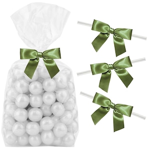 May include: Clear cellophane bags filled with white candy balls, tied with green satin ribbon bows. Three additional green satin ribbon bows are shown on clear plastic sticks.