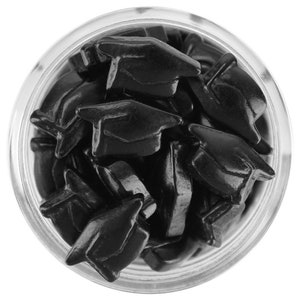 May include: A clear glass jar filled with black candy shaped like graduation mortarboards. The candy is glossy and reflects light, creating highlights. The jar is set against a white background, emphasizing the dark color of the candy.