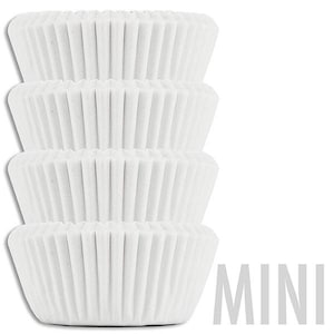 May include: A stack of four white mini cupcake cases. The cases are made of paper and have a fluted design. The word "MINI" is printed in grey letters below the cases.