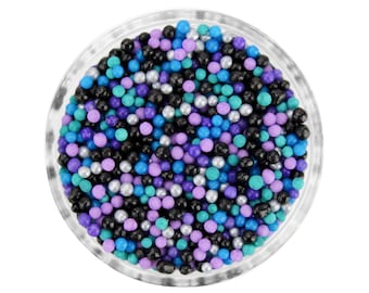 Galaxy Nonpareils Blend - Our galaxy blend is a mix of classic tiny nonpareils in teal, black, purple, pearly silver, lavender, and blue.