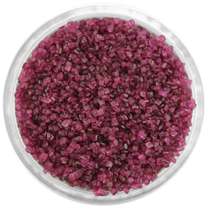 May include: A clear glass jar filled with pink sugar crystals. The sugar crystals are small and have a slight shimmer.