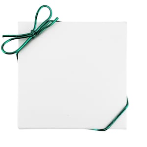 May include: A white gift box with a green ribbon tied in a bow.