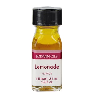 May include: A small glass bottle with a black cap filled with a yellow liquid. The label reads "Lorann Oils Lemonade Flavour 1 fl dram 3.7 ml .125 fl oz".