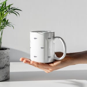 Great White Shark Lover Gift for Marine Biologist Cup designed as a minimalist Shark Week Mug. Ocean animal coffee mug for diver, scuba fan, or marine life enthusiast. Fun and practical marine biologist gift idea for ocean research lovers. Marine animal cup with modern design makes an ideal shark enthusiast coffee mug for daily use or as a memorable Shark Week present.