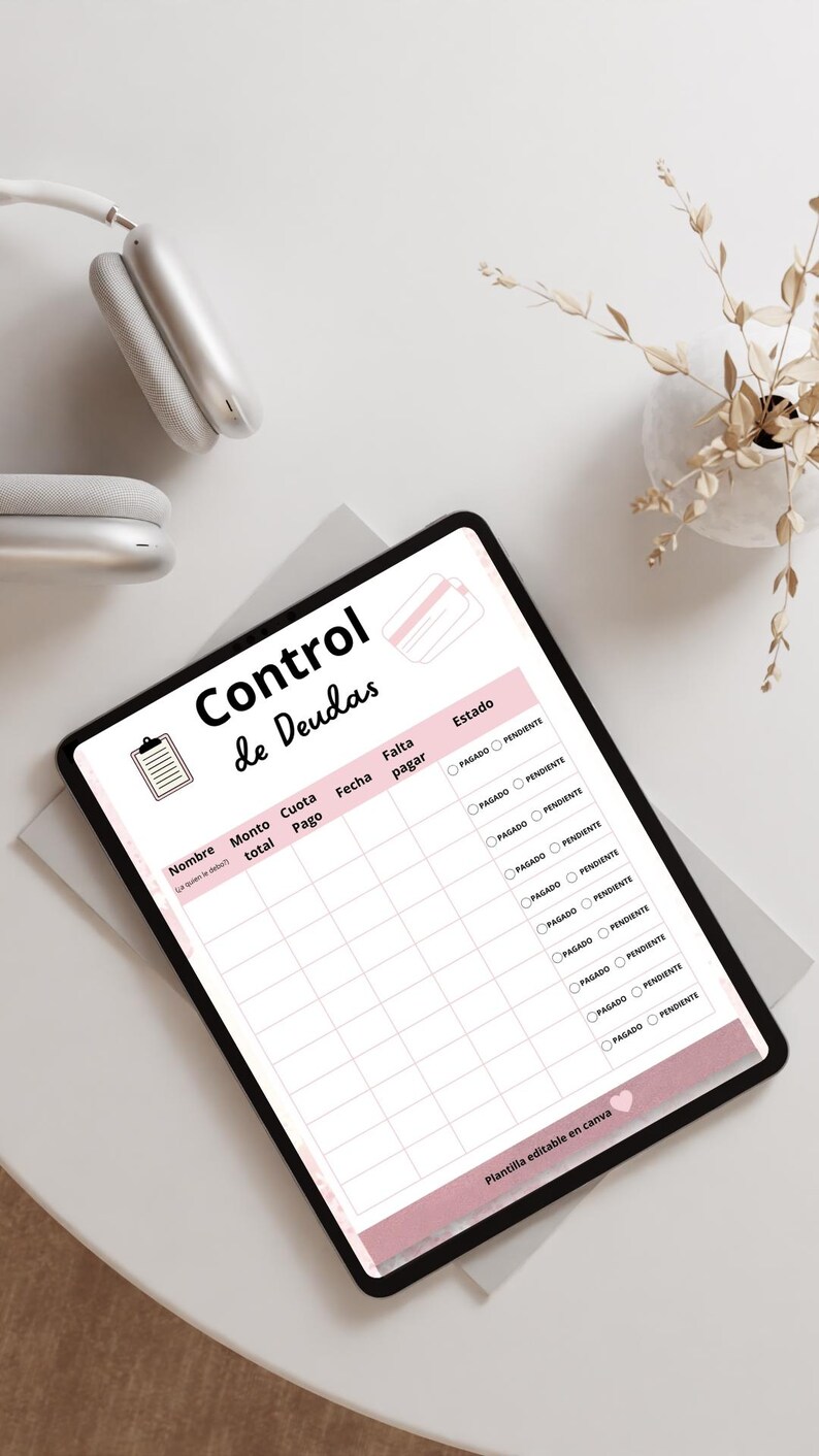May include: A digital tablet displaying a debt tracker template with the title "Control de Deudas". The template includes fields for name, total amount, payment, date, and status. The design features a pink and white color scheme.