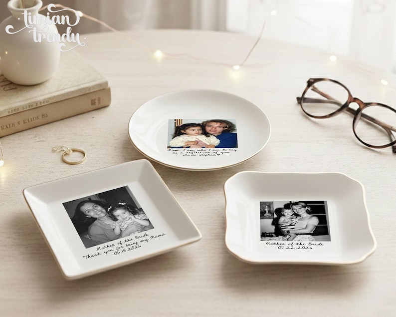 May include: Three white ceramic trinket dishes featuring personalized black and white photographs and handwritten-style text. One round dish and two square dishes display family photos with inscriptions including dates and messages like Mother of the Bride.