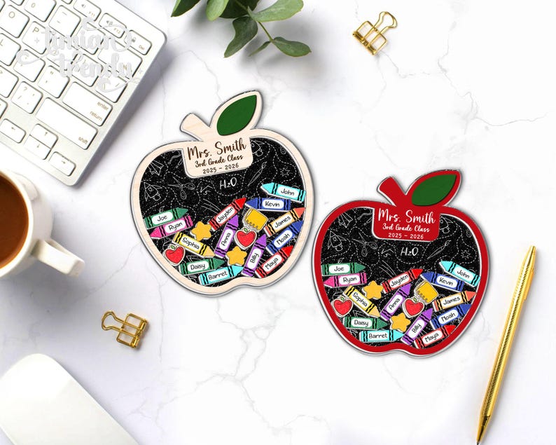 May include: Two apple-shaped teacher gifts with a chalkboard design. The gifts are personalized for "Mrs. Smith, 3rd Grade Class 2025-2026." Each apple features colorful crayon and star accents with student names. One apple is red, the other is natural wood.