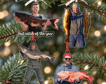 May include: Four custom photo ornaments featuring individuals holding large fish. One ornament includes the text Best catch of the year and another includes the text Dylan 2026. Each ornament is suspended by a white ribbon and displays a unique person.