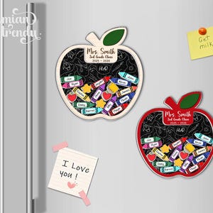 May include: Two apple-shaped magnets with a chalkboard design, filled with crayon-shaped name tags. One magnet is red, the other is beige. Both magnets have the text "Mrs. Smith 3rd Grade Class 2025-2026". A sticky note says "Get milk".