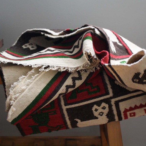 vintage. red. brown. geometric. navajo. aztec. animals. natural wool rug. wall hanging. southwestern decor.