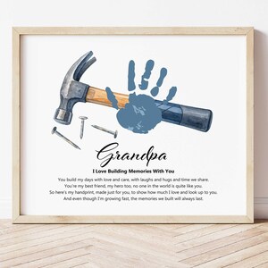 May include: Framed print featuring a hammer, nails, and a blue handprint. The text reads "Grandpa I Love Building Memories With You" and includes a heartfelt message. A touching gift for a grandfather.