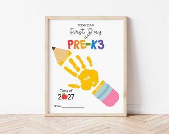 May include: A framed print with the text "Today is my First Day of PRE-K3" in colorful letters. A yellow handprint and a pencil illustration are featured. The print also includes "Class of 2027" and a space for a name.